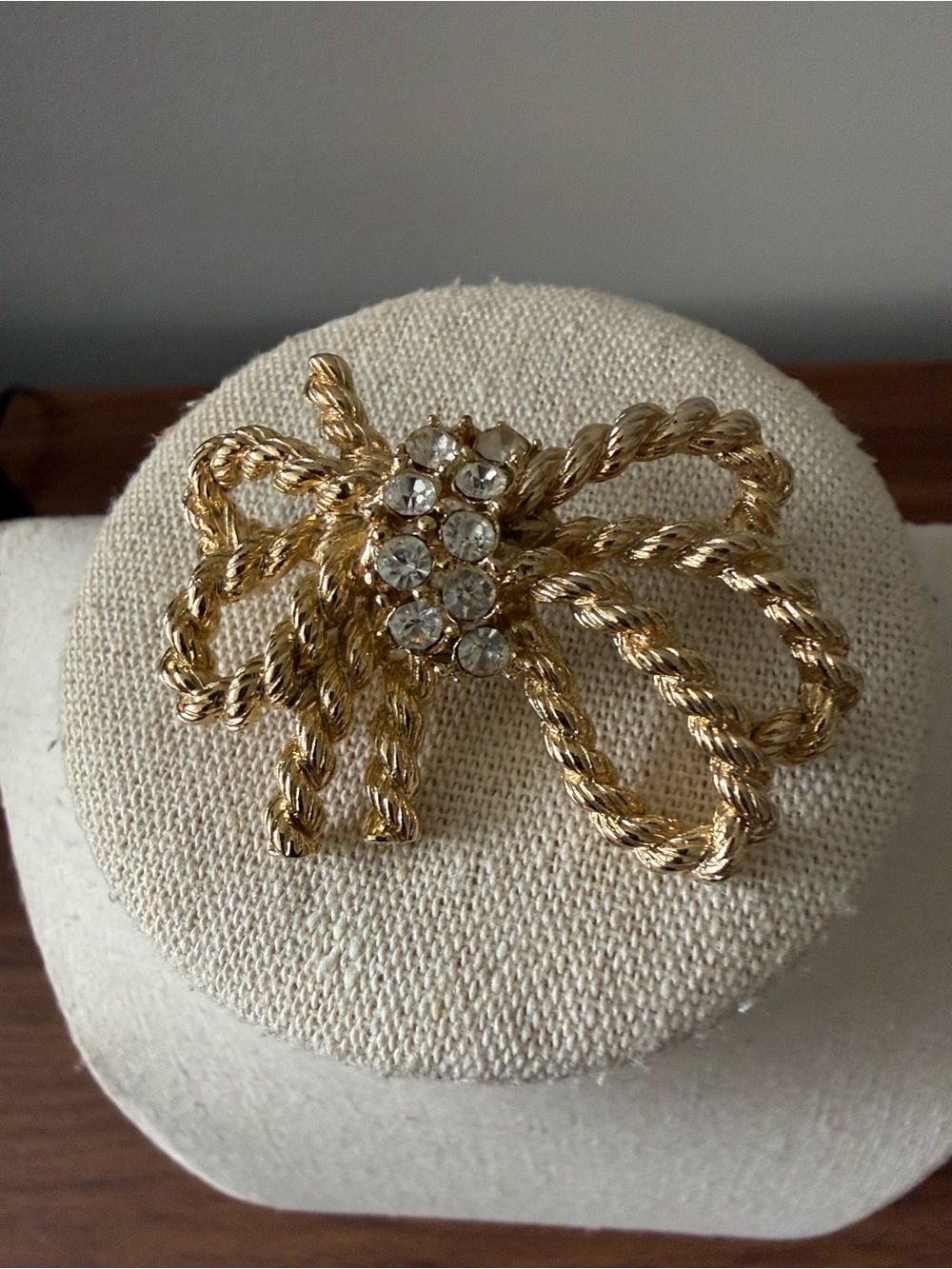 Vintage M Jent Signed Gold Tone Bow Brooch with Rhinestone Center.